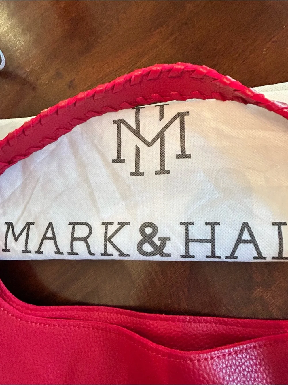 Mark & Hall shoulder Red pebbled Hobo Bag with Braided Trim and red tassel.